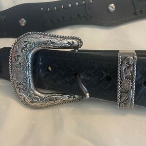 Stylish Black Leather Belt with Intricate Silver Buckle